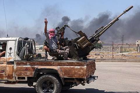 Bedouin and tribal fighters deploy at the western entrance of Syria's Druze heartland of Sweida on July 18, 2025.