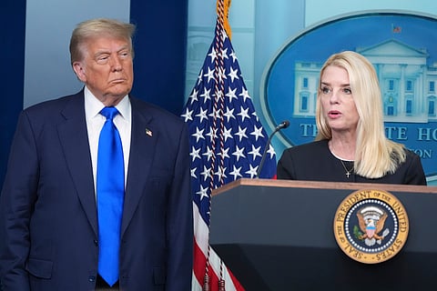 Attorney General Pam Bondi speaks to reporters as President Donald Trump listens, Friday, June 27, 2025, in the briefing room of the White House in Washington. (AP Photo/Jacquelyn Martin)