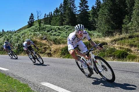 UAE Team Emirate - XRG team's Slovenian rider Tadej Pogacar cycles in the descent of Col du Soulor during the 12th stage of the 112th edition of the Tour de France cycling race, 180.6 km between Auch and Hautacam, in the Pyrenees mountains of southwestern France, on July 17, 2025.
