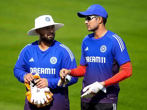 India skipper Shubman Gill (right) and his deputy Rishabh Pant discuss a strategy during a nets session at Emirates Old Trafford on Monday.
