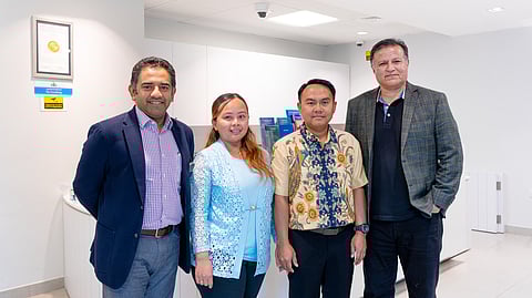 Indonesian expat Ellyzabeth Bella Lukitasari standing for a photograph after her vision was restored.