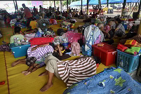 Evacuees displaced by the ongoing conflict between Thailand and Cambodia rest at a makeshift evacuation centre inside a Buddhist temple in the Thai border province of Si Sa Ket on July 26, 2025.