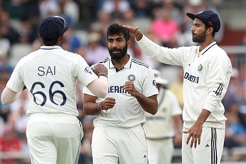 India's Jasprit Bumrah (C) celebrates with India's Sai Sudharsan (L) and India's Washington Sundar (R) after the dismissal of England's Liam Dawson on day four of the fourth cricket test match between England and India at Old Trafford, in Manchester, north England, on July 26, 2025.