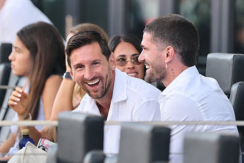 Lionel Messi of Inter Miami CF and Rodrigo de Paul, new Inter Miami CF signing smile on the bench during the MLS match between Inter Miami CF and FC Cincinnati at Chase Stadium on July 26, 2025 in Fort Lauderdale, Florida.