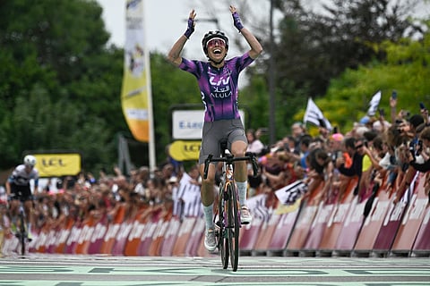Liv-Alula-Jayco team's Spanish rider Mavi García celebrates as she crosses the finish line to win the 1st stage (out of 9) of the fourth edition of the Women's Tour de France cycling race, 78,8 km from Vannes to Plumelec, in Plumelec, western France, on July 26, 2025.