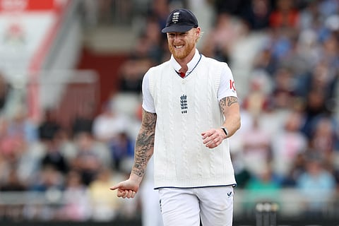 England's captain Ben Stokes reacts to a stiff shoulder on day five of the fourth Test against India at Old Trafford.