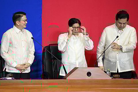 File photo: Philippine President Ferdinand Marcos (C) joins Senate President Chiz Escudero (L) and Speaker of the House Martin Romualdez (R) in the upper rostrum after delivering his speech during the State of the Nation Address at the House of Representatives on July 28, 2025.