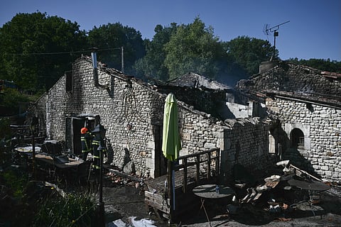 Firefighters work at the site of a French holiday cottage gite for disabled adults.