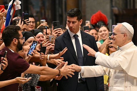 Pope Leo XIV (R) salutes faithful during the mass for the Jubilee of digital missionaries and Catholic influencers celebrated by Filipino Cardinal Luis Antonio Tagle at St. Peters’ Basilica at the Vatican on July 29, 2025.