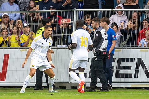 Saudi Pro League football club Al-Nassr's Portuguese forward Cristiano Ronaldo celebrates scoring with his teammate Nassr's Senegalese Forward Sadio Mane during a friendly football match agtainst FC Toulouse in Groedig, Austria on July 30, 2025.