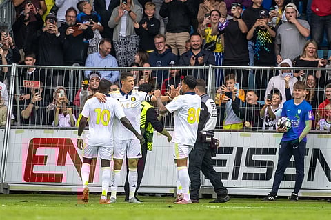 Saudi Pro League football club Al Nassr's Cristiano Ronaldo celebrates with teammates after scoring against FC Toulouse during a friendly in Groedig, Austria.