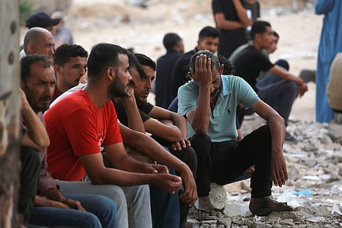 Palestinians mourn outside the Al Shifa hospital in Gaza City on July 31, 2025, where bodies of people killed a day earlier while waiting for aid were brought.