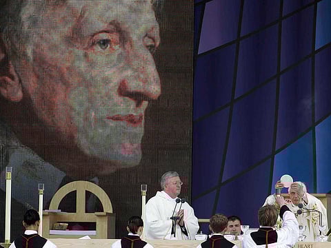 File: Pope Benedict XVI, right, celebrates a beatification mass for Cardinal John Henry Newman in Birmingham, England, Sunday, Sept. 19, 2010.