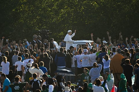 Pope Leo XIV waves as he arrives before leading a mass in the Tor Vergata district of Rome, as part of Jubilee of Youth, on August 3, 2025.