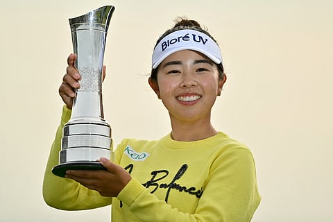 Japan's Miyu Yamashita lifts the trophy after winning on the final day of the Women's British Open Golf Championship, at Royal Porthcawl in south Wales on August 3, 2025.