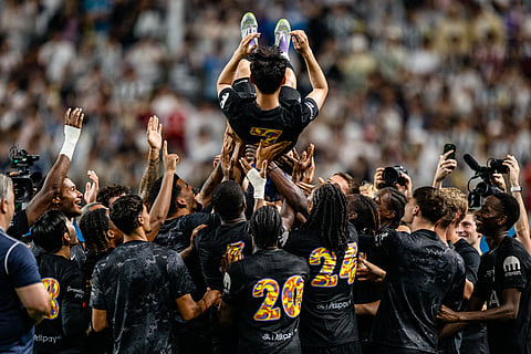 Teammates lift Tottenham Hotspur's captain Son Heung-min up in the air during celebrations to bid him farewell at the end of a friendly football match between Tottenham Hotspur and Newcastle United in Seoul on August 3, 2025.