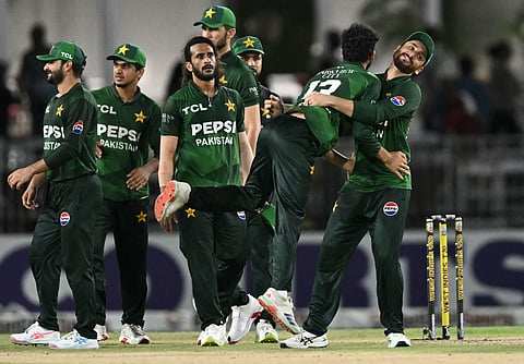 Pakistan’s captain Salman Ali Agha (right) picks-up Sufiyan Muqeem as they celebrate after their team won the third Twenty20, sealing a 2–1 series victory over West Indies in Lauderhill on Sunday.