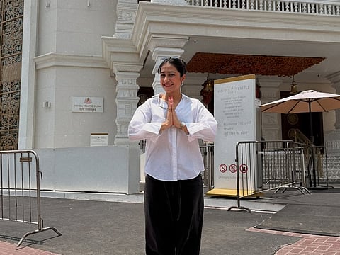 Dhanashree Verma poses in front of the Hindu Mandir in Jebel Ali on Monday.