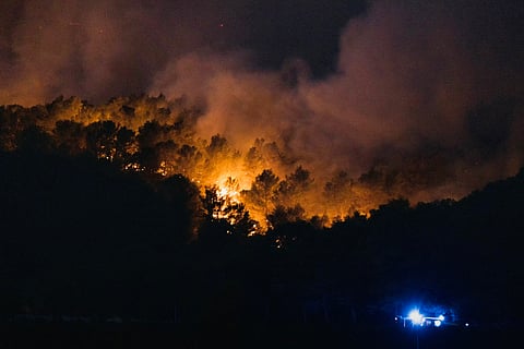 Smoke billows from a forest fire in Tournissan, southwestern France, on August 5, 2025.