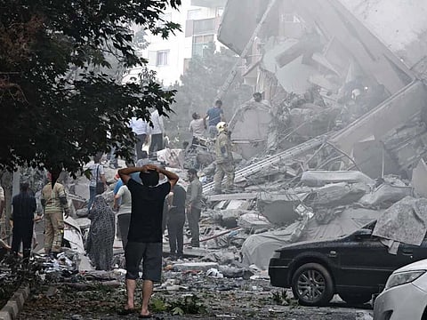 People look over damage to buildings in Nobonyad Square following Israeli airstrikes on June 13, 2025 in Tehran, Iran.