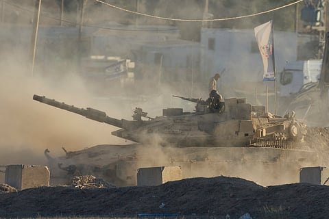 An Israeli tank moves near the border of the Gaza Strip in southern Israel, Wednesday, August 6, 2025.