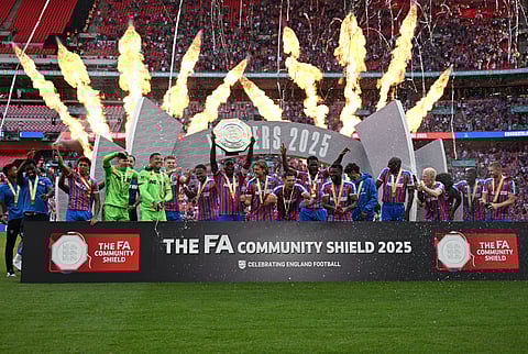 Crystal Palace's players celebrate with the trophy after Palace win the English FA Community Shield football match against Liverpool at Wembley Stadium, in London on August 10, 2025.