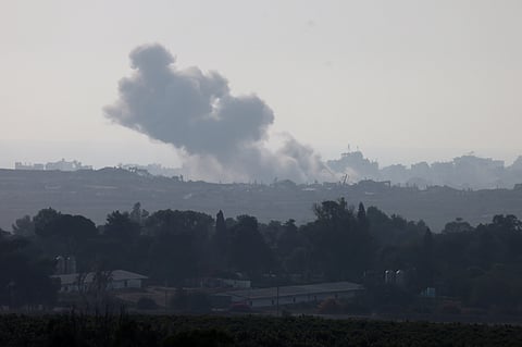 This picture taken from a position on the Israeli border with the Gaza Strip, shows smoke rising during an Israeli strike on the besieged Palestinian territory on August 10, 2025.
