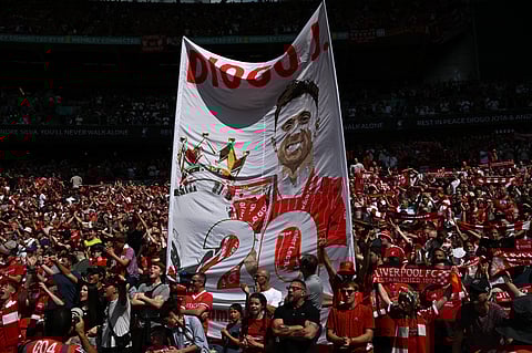 Liverpool fans display a banner to pay tribute to Liverpool's Portuguese forward Diogo Jota ahead of the English FA Community Shield match against Crystal Palace.
