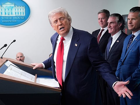 President Donald Trump, from left, speaks with reporters as Army Secretary Dan Driscoll, Interior Secretary Doug Burgum and Defense Secretary Pete Hegseth listen in the James Brady Press Briefing Room at the White House in Washington.