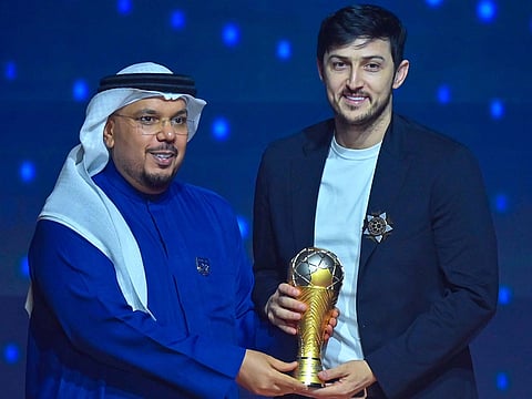 Sardar Azmoum claiming the Golden Ball for Best Player of the season award.