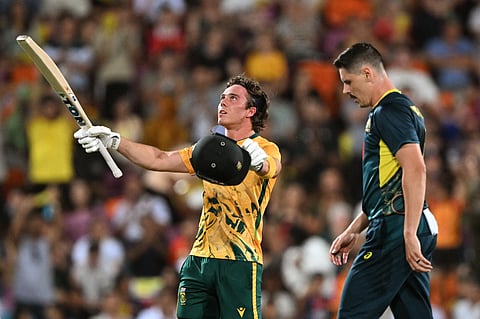 South Africa's batsman Dewald Brevis (left) celebrates his century as Australia's Ben Dwarshuis looks on during the second Twenty20 in Darwin on Tuesday.