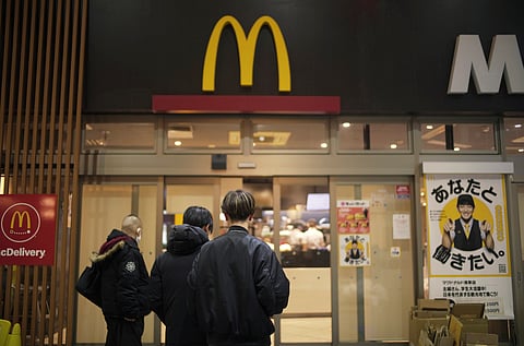 People stand outside a McDonald's store in Tokyo.
