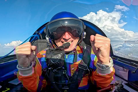 This handout picture taken on August 12, 2025 by Swiss pilot Raphael Domjan and made available on August 13, 2025 shows him reacting after receiving the news that he beat the altitude record for a solar-powered electric plane.