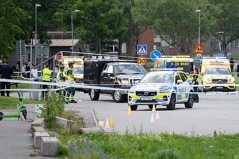 Police work at the scene outside a mosque in Orebro after a shooting where several people injured in Orebro, Sweden on August 15, 2025.