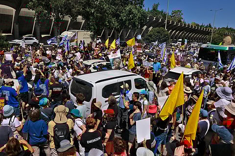 Families and supporters of Israelis held hostage by Hamas militants in Gaza since the October 7, 2023 attacks, during a protest in Jerusalem on August 17, 2025, calling for government action to secure their release.