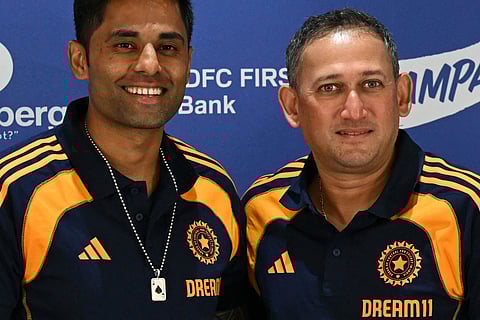 Indian cricket captain Suryakumar Yadav and Ajit Agarkar wear the Indian jersey's with Dream11 logos.