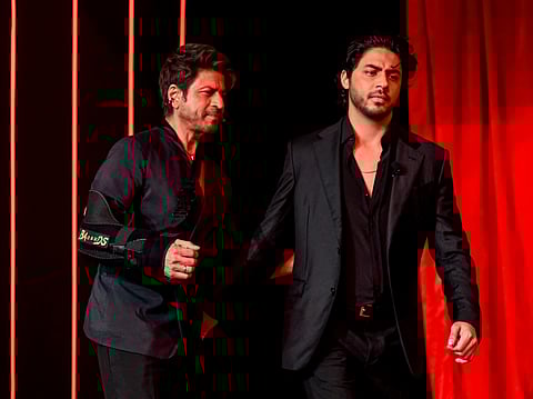 Bollywood actor Shah Rukh Khan (L) and his son Aryan Khan in August