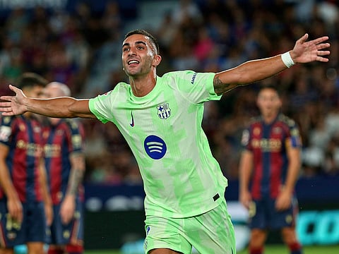 Barcelona's Ferran Torres reacts after scoring during the La Liga soccer match between Levante and Barcelona in Valencia, Spain