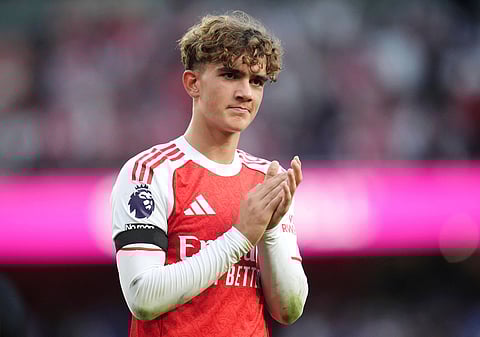 Arsenal's Max Dowman acknowledges the fans after the English Premier League soccer match between Arsenal and Leeds United at Emirates stadium in London, England, Saturday, Aug. 23, 2025. (John Walton/PA via AP)
