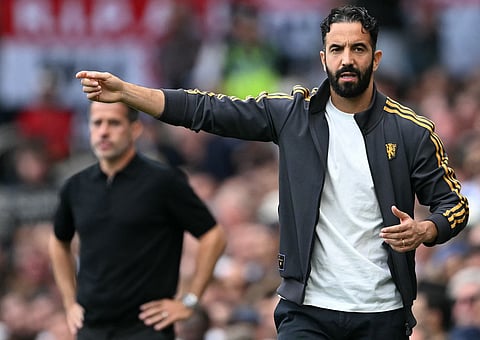 Fulham's Portuguese head coach Marco Silva (L) and Manchester United's Portuguese head coach Ruben Amorim watch the players from the touchline during the English Premier League match on Sunday.