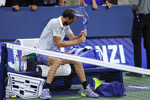 Russia's Daniil Medvedev breaks his racket after losing his men's singles first round tennis match against France’s Benjamin Bonzi on day one of the US Open tennis tournament at the USTA Billie Jean King National Tennis Center in New York City, on August 24, 2025.