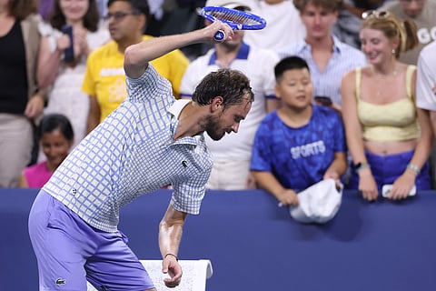 Daniil Medvedev breaks his racket after losing to Benjamin Bonzi of France after the first round match of the 2025 US Open on August 24, 2025.