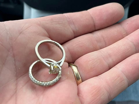 Husband braves 18 tons of trash to look for lost wedding rings