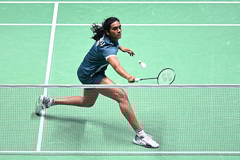India's Pusarla Venkata Sindhu hits a return to Bulgaria's Kaloyana Nalbantova during their women's singles match at the badminton BWF World Championships at the Adidas Arena in Paris, on August 26, 2025.