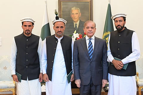 Pakistan Prime Minister Shehbaz Sharif with shepherds who saved more than 300 lives in floods in Gilgit Baltistan.