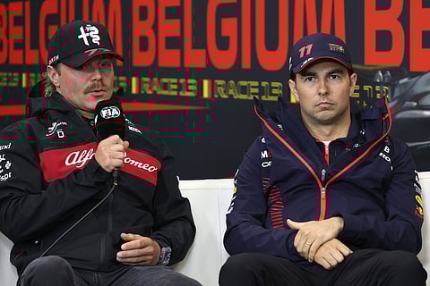 Alfa Romeo driver Valtteri Bottas of Finland, left, and Red Bull driver Sergio Perez of Mexico participate in a media conference ahead of the Formula One Grand Prix at the Spa-Francorchamps racetrack in Spa, Belgium, July 27, 2023.