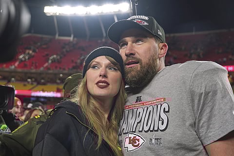 Kansas City Chiefs tight end Travis Kelce, right, appears with singer Taylor Swift after the Chiefs victory over the Buffalo Bills in the AFC Championship game in Kansas City, Mo., on Jan. 26, 2025.