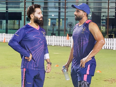 UAE skipper Muhammad Waseem talks to Strength and Conditioning coach Azharuddin Qureshi during a practice session at the ICC Academy Grounds in Dubai.