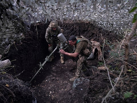 Soldiers fire a mortar towards positions of Russian troops near Kostyantynivka in Donetsk region, Ukraine.