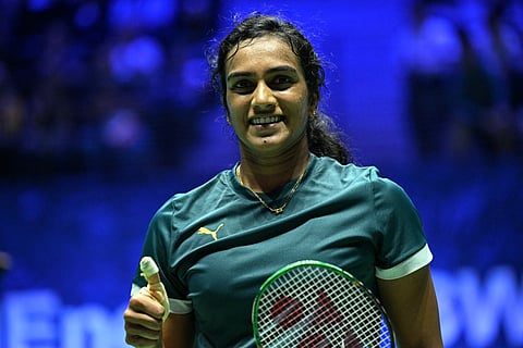 India's V. Sindhu Pusarla celebrates after winning against China's Wang Zhi Yi (unseen) during their women's single match at the Badminton BWF World Championships at the Adidas Arena in Paris, on August 28, 2025.